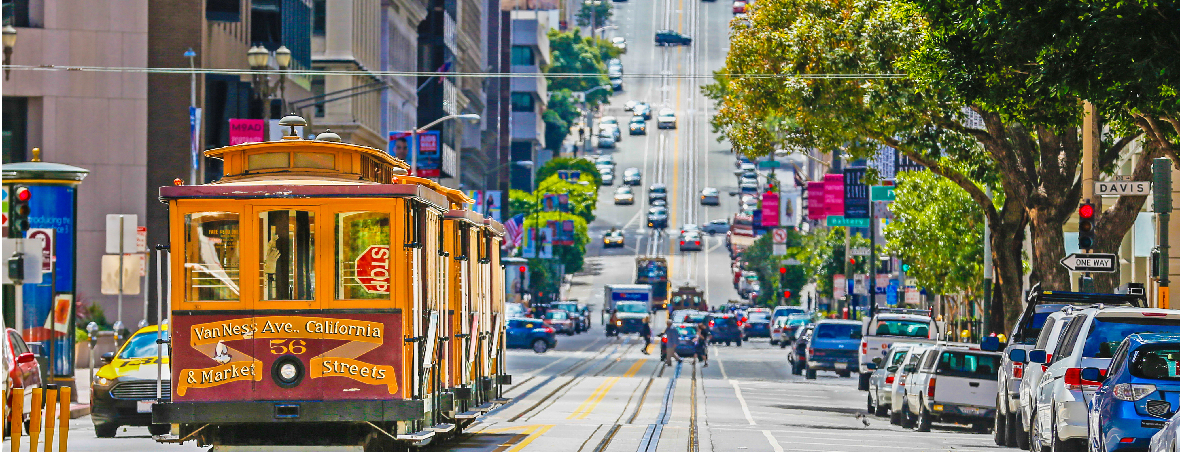 Professionally dressed individuals reading on their tablets and smartphones